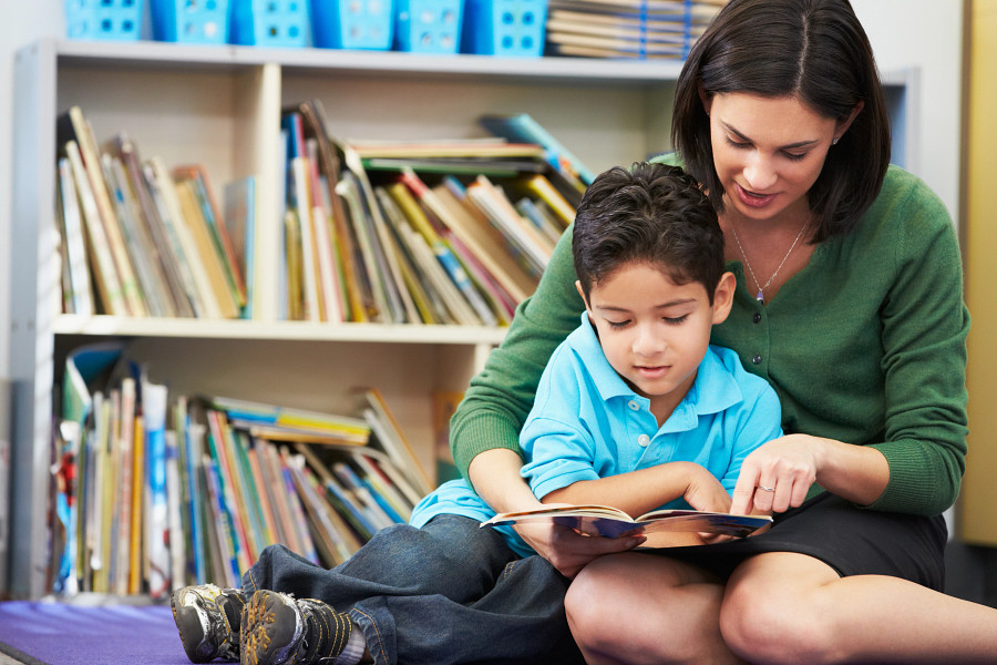 Teacher and Student Reading Together