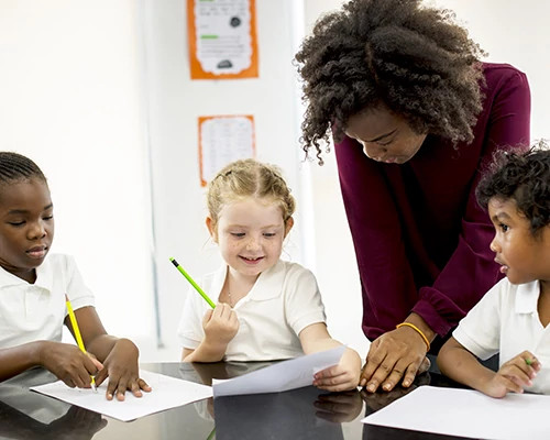 Students with Teacher at table