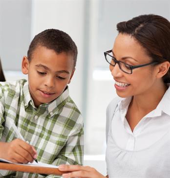 Teacher and student with notes