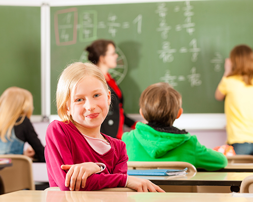 Student in math class smiling