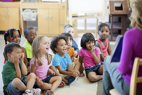 PreK Students listening to Teacher