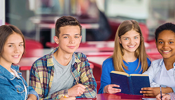 Students at table with books