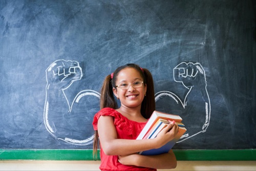 Supercharged Readers Girl in front of chalkboard