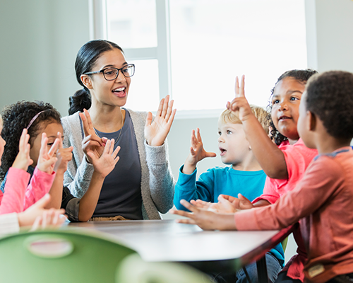 Teacher and Students at Table